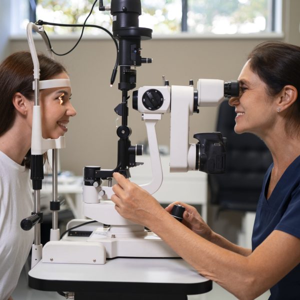 medium-shot-woman-getting-her-eyes-checked