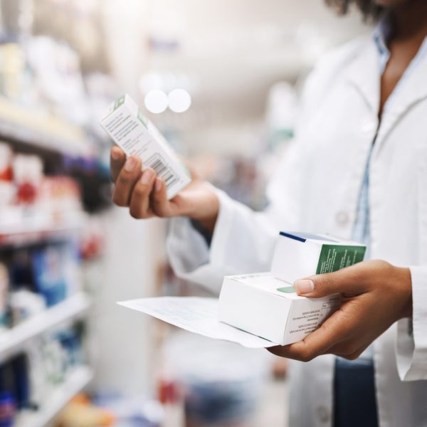 Cropped shot of an unrecognizable young female pharmacist working in a pharmacy.